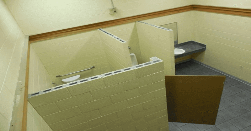 School principal arrested after camera found in girls' toilet